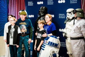 Family fun at a movie with a symphony orchestra live